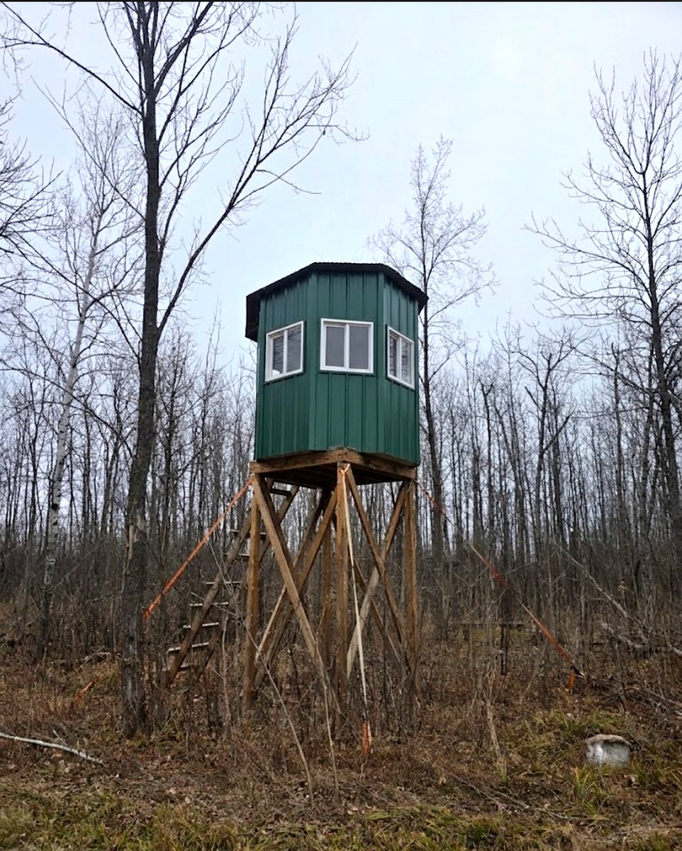 Custom octagon elevated hunting blind with windows on every side
